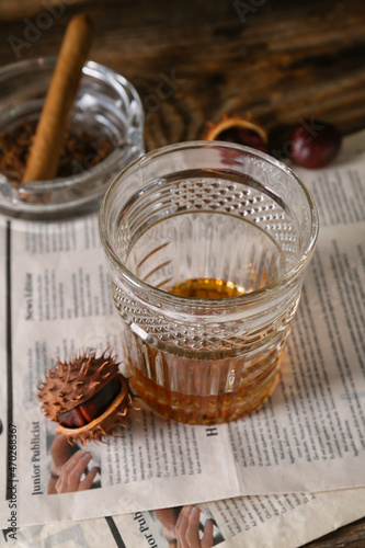 Glass of chestnut whiskey a...