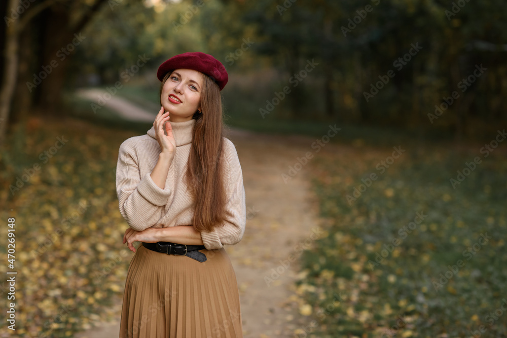 Beautiful Caucasian girl in autumn park with leaves Beautiful Caucasian girl in autumn park with leaves