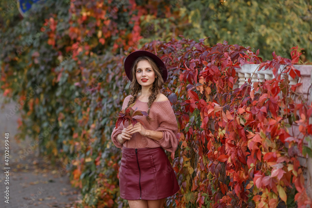 Beautiful Caucasian girl in autumn park with leaves Beautiful Caucasian girl in autumn park with leaves