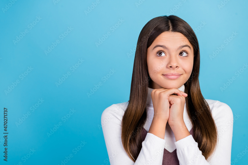 Photo of young pretty girl wondered look empty space think minded isolated over blue color background Photo of young pretty girl wondered look empty space think minded isolated over blue color background
