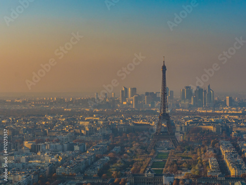                                                                                  France is Paris. View from the Montparnasse Tower. Eiffel Tower illuminated by the setting sun.