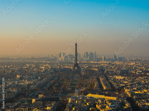                                                                                  France is Paris. View from the Montparnasse Tower. Eiffel Tower illuminated by the setting sun.