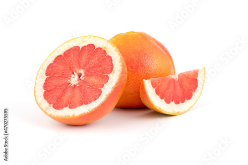 Fresh tasty grapefruit, whole and cut exotic fruit, citrus fruits, healthy fruit, close-up isolated