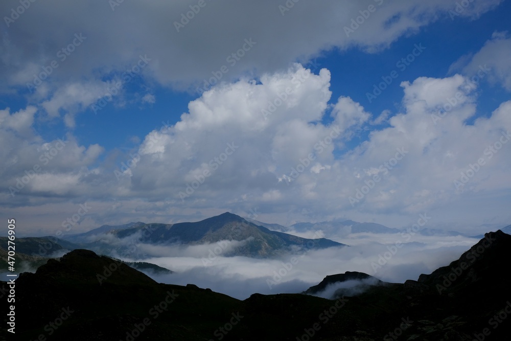 Beautiful mountain view above clouds during hiking on peak Djeravica (Gjerovica) - the highest peak of Kosovo. Albanian Alps, Peaks of Balkans