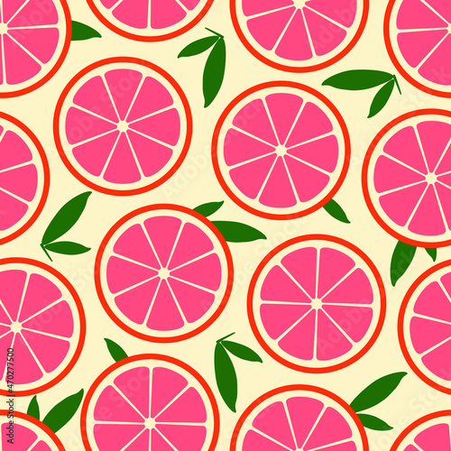 Seamless vector pattern with grapefruit slices and green leaves