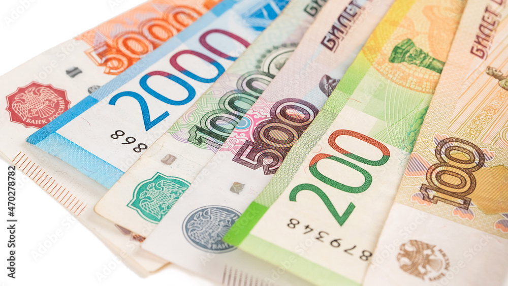 Close-up of banknotes. Five thousand, five hundred, ten thousand, lead and one hundred rubles. Close-up of banknotes. Five thousand, five hundred, ten thousand, lead and one hundred rubles.