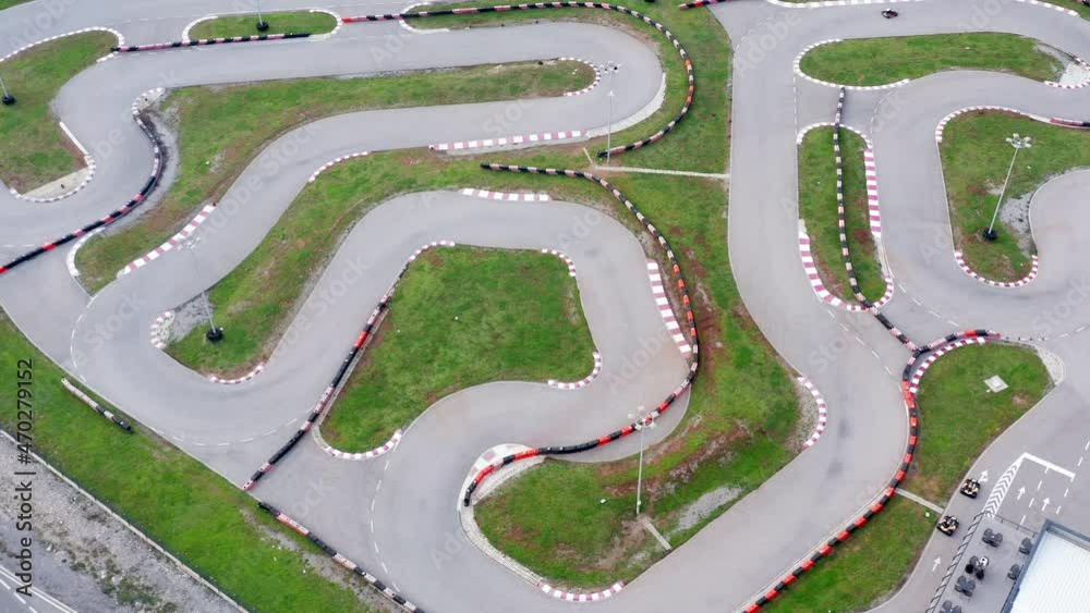 Kart circuit - race track for go cart, motorcycle, bike or radio-controlled model racing. Aerial drone view of the raceway or speedway route with curves.