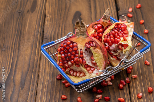 Juicy pomegranate in a shopping trolley