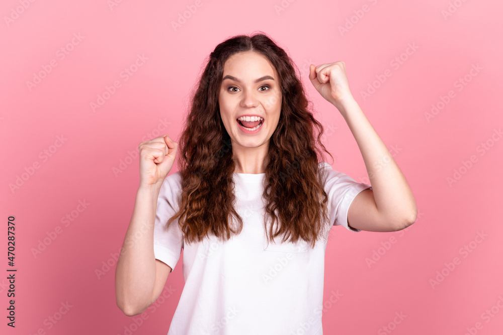 Photo of young excited girl good mood rejoice victory win lottery discount isolated over pink color background Photo of young excited girl good mood rejoice victory win lottery discount isolated over pink color background