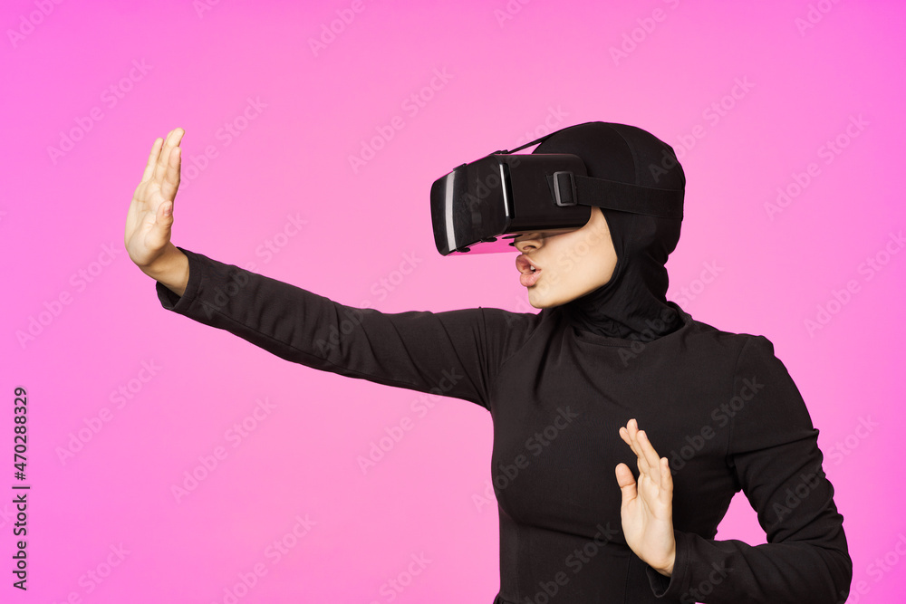 muslim woman wearing virtual reality glasses entertainment technology device muslim woman wearing virtual reality glasses entertainment technology device