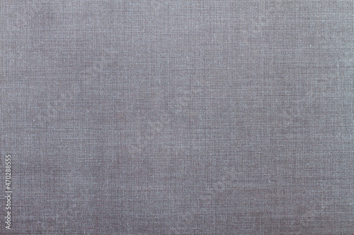 Grey fabric background with interlacing threads. Copy Space