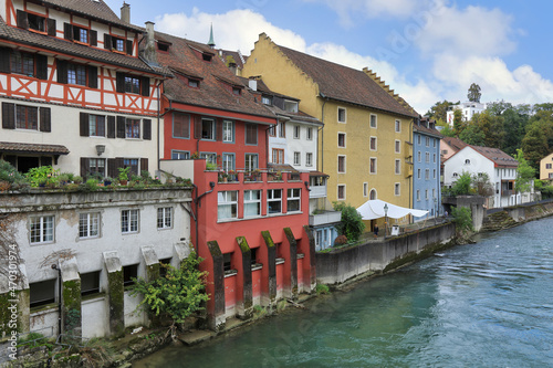Limmat river embankment with medieval houses. Baden, canton of Aargau, Switzerland.