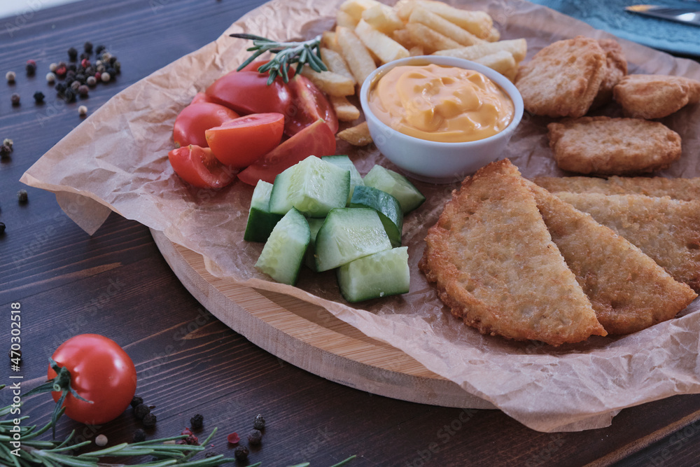 Fried cheese and chips with vegetables Fried cheese and chips with vegetables