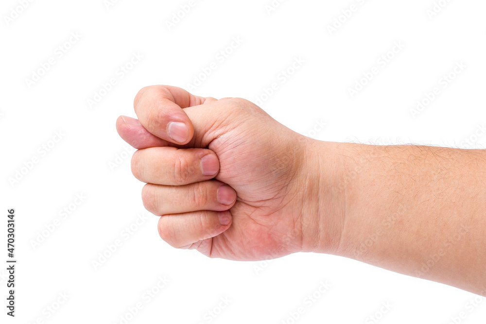 A man's hand shows a fist with a clenched thumb on a white background. A man's hand shows a fist with a clenched thumb on a white background.