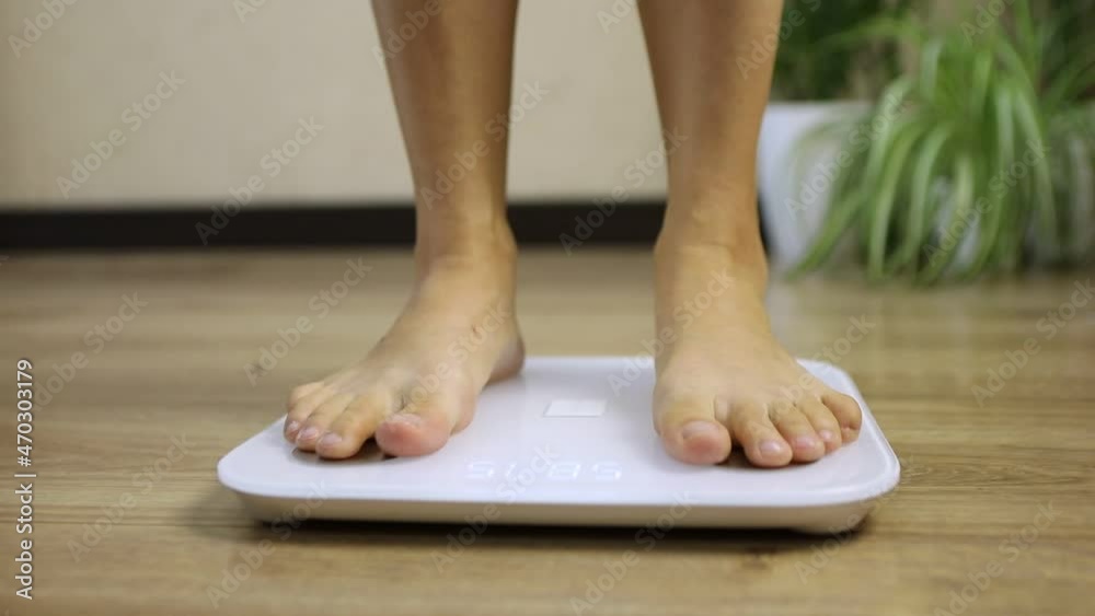 women step on the scale weight control women step on the scale weight control