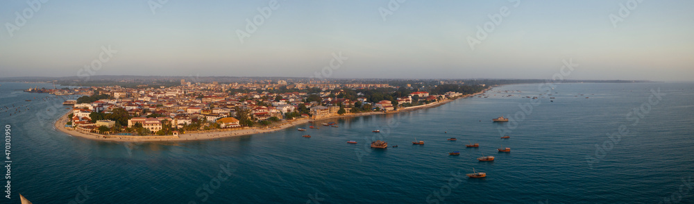 Tropical island of Zanzibar, Tanzania. Coastline, ocean and boats on the shores of Zanzibar city
