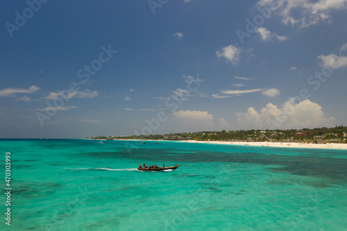 Tropical island of Zanzibar, Tanzania. The fishing boat is sailing to the shore