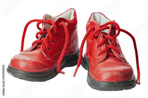 Children's shoes of red color isolated on white background. Old shoes.