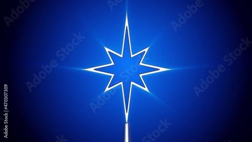 Silver Bethlehem star tree topper on blue background