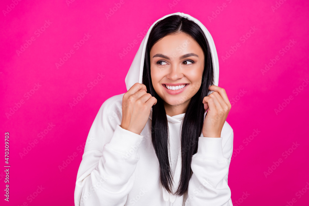 Photo of young excited girl wear hoodie wondered look empty space isolated over magenta color background Photo of young excited girl wear hoodie wondered look empty space isolated over magenta color background