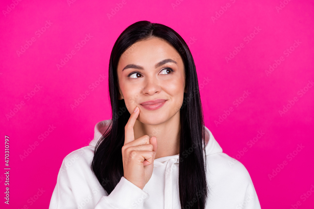 Photo of young attractive millennial girl finger touch chin think look empty space isolated over magenta color background Photo of young attractive millennial girl finger touch chin think look empty space isolated over magenta color background