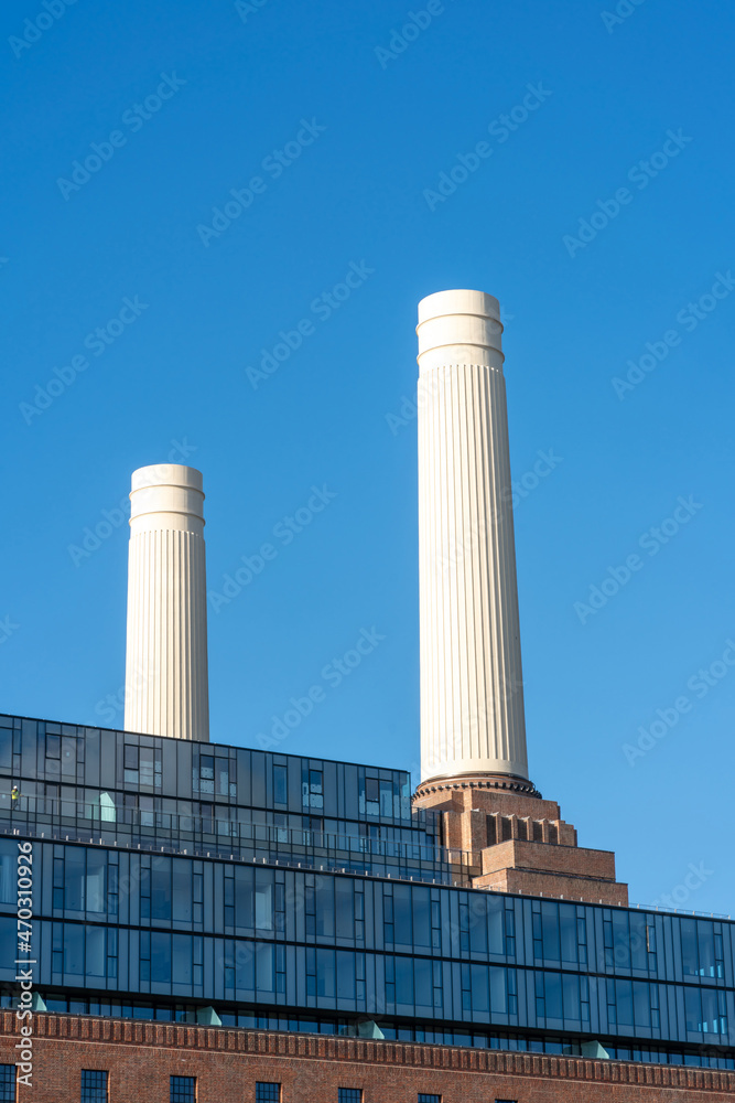 Chimneys of Battersea Power station against blue sky, London, UK
