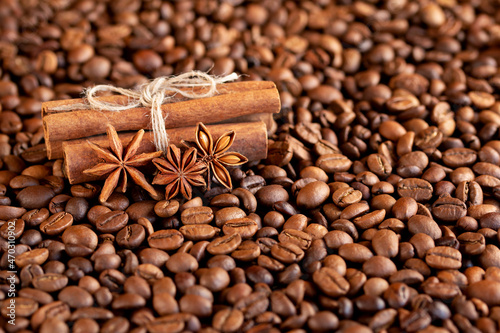 star anise and cinnamon on coffee beans