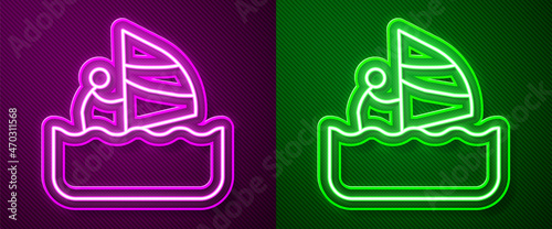 Glowing neon line Windsurfing icon isolated on purple and green background. Vector