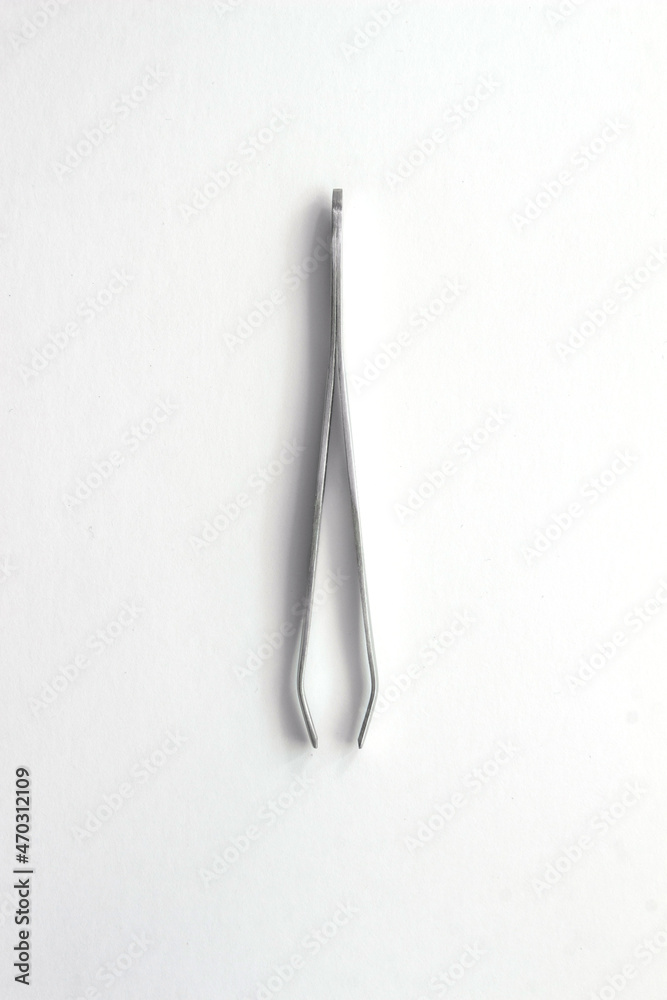 manicure tweezers isolated on white background. High quality photo manicure tweezers isolated on white background. High quality photo