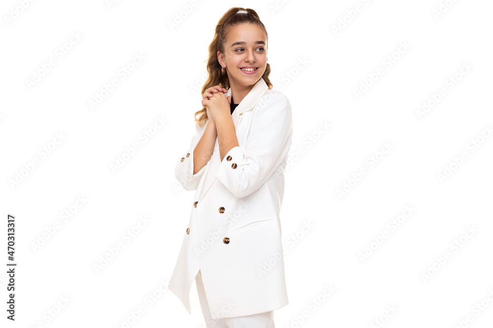 Photo of beautiful amazing cute adorable positive smiling brunette teenage girl with ponytail in stylish white jacket and white pants isolated on white background with copy space for text Photo of beautiful amazing cute adorable positive smiling brunette teenage girl with ponytail in stylish white jacket and white pants isolated on white background with copy space for text