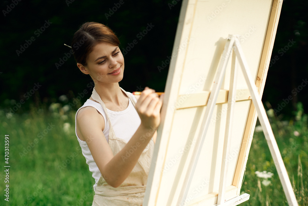 woman artist paints a picture near easel outdoors landscape creative woman artist paints a picture near easel outdoors landscape creative