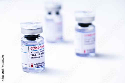 Coronavirus vaccine, COVID-19 vaccine, corona vaccination. Vials of mRNA vaccine for injection on a white background.