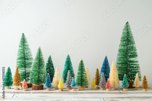 Christmas and New Year pine tree decoration on wooden table over white background.