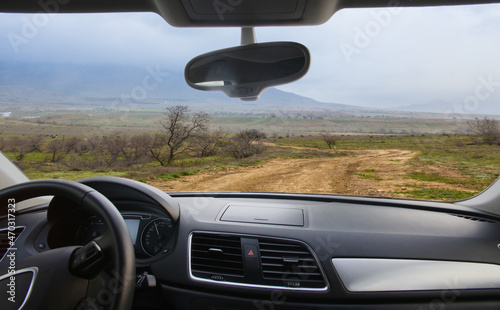 View from the Car to the Dirt Winding Road