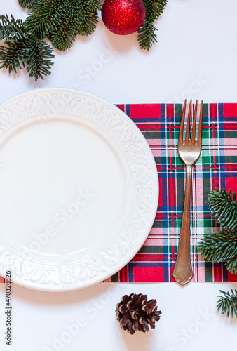 Christmas or New Year table settings with festive decorations on the white background. Top view 