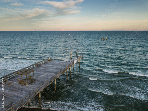 Aerial drone image of a hurricane Storm damaged Fishing pier on the Atlantic Ocean off the South Carolina Coast