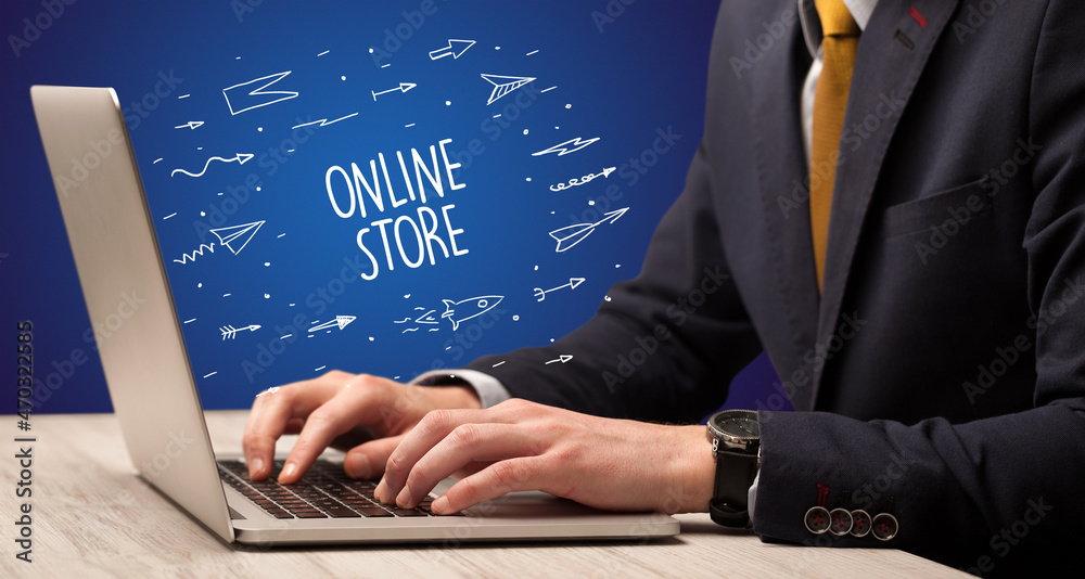 Businessman working on laptop, e-commerce concept