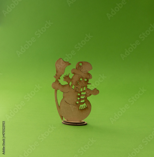 Christmas decoration of snow white.  Creative idea on a green background.