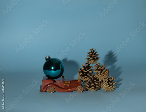Holidays are coming, a pine cone on a blue background. Christmas. Creative idea.