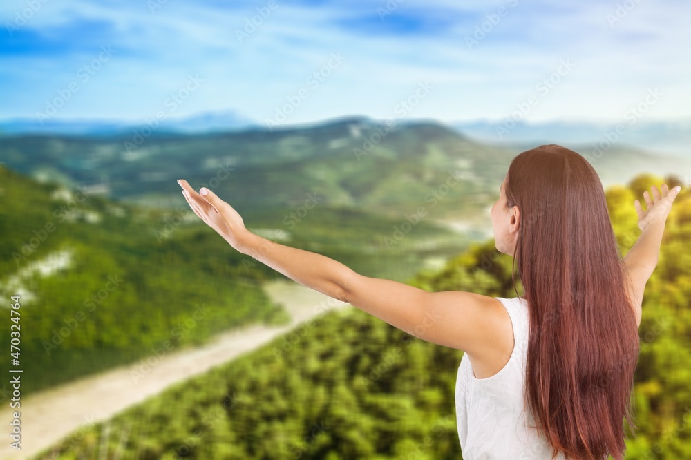 Woman raised hands up on top of mountain and sunset background. Freedom, Pray, Woman raised hands up on top of mountain and sunset background. Freedom, Pray,