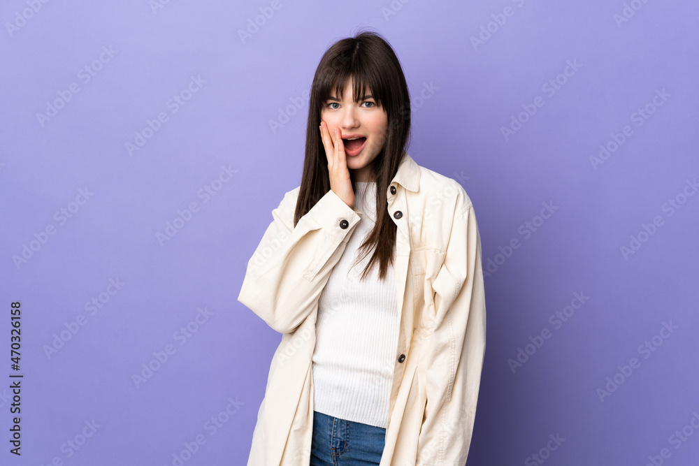 Young Ukrainian woman isolated on purple background with surprise and shocked facial expression Young Ukrainian woman isolated on purple background with surprise and shocked facial expression