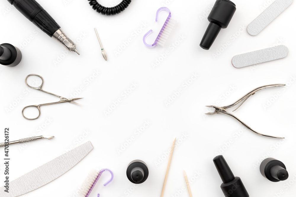 Flat lay top view tools for manicure on white background Flat lay top view tools for manicure on white background