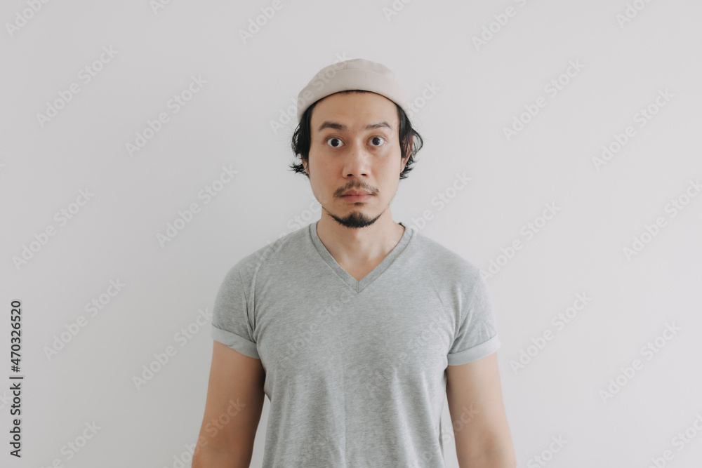 Long hair and beard Asian man in grey t-shirt and cap isolated on white. Long hair and beard Asian man in grey t-shirt and cap isolated on white.