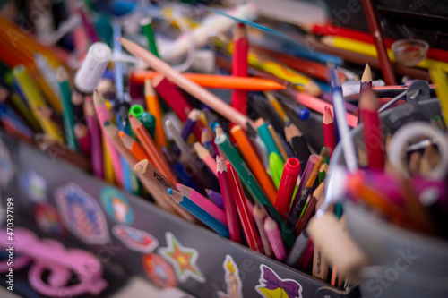 pencils, colored pencils, creative clutter on the table, drawing tools, children's creativity