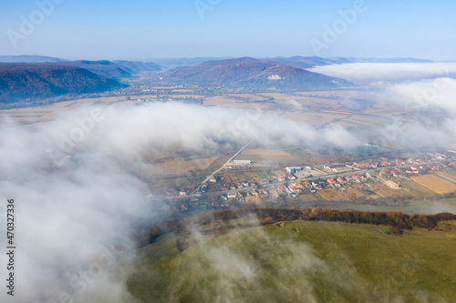 Aerial view of industrial zone covered with autumn fog in Dej, Romania. photo