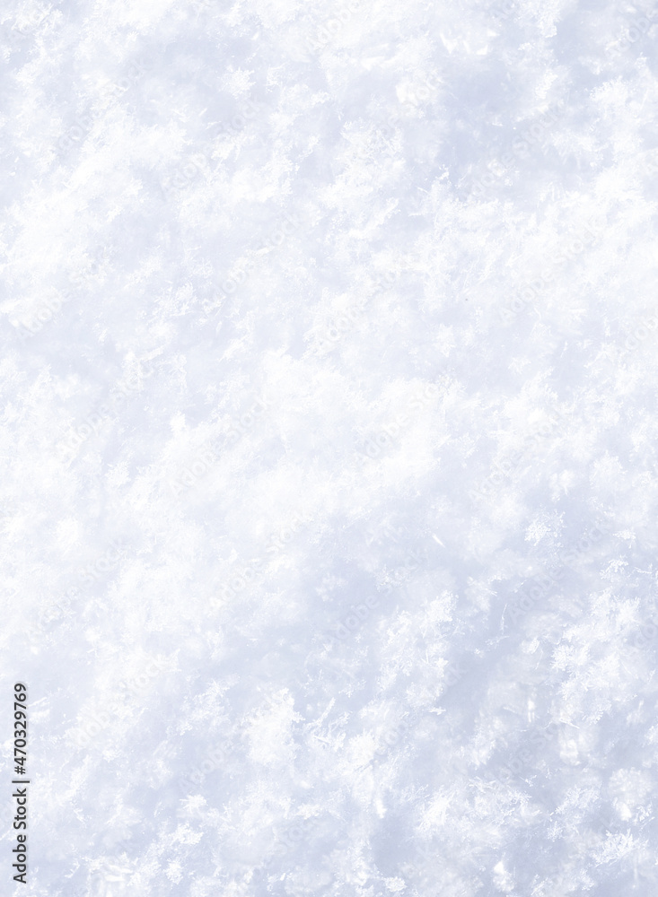Snow crystals texture. A layer of shiny white snow. Winter background for Christmas projects. 