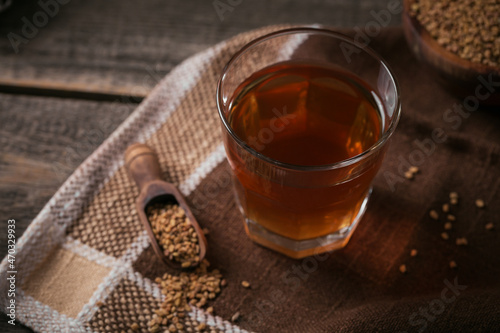 Fototapeta Naklejka Na Ścianę i Meble -  Egyptian fenugreek yellow tea or Methi Dana drink and fenugreek seeds