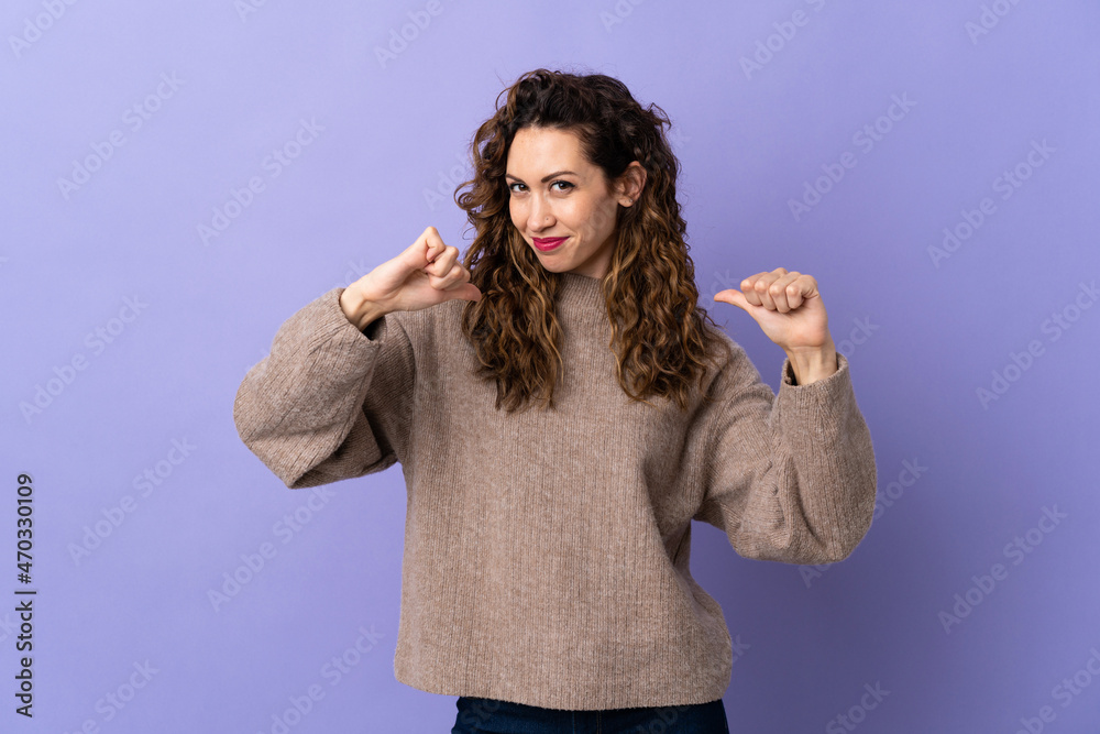 Young caucasian woman isolated on purple background proud and self-satisfied Young caucasian woman isolated on purple background proud and self-satisfied