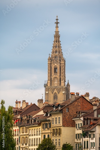 Travel to Switzerland. Berner Münster cathedral with amazing architecture tower photographed during a cloudy morning. Landmark of this city from Bern. © Dragoș Asaftei