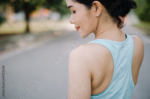 A beautiful woman stretching her body before going for a run in the morning.women's health care concept
